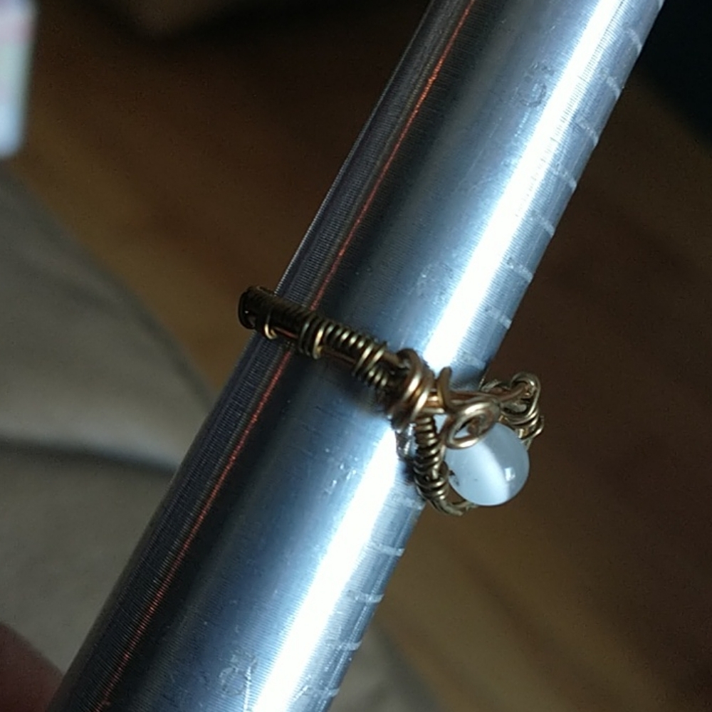 Hand crafted wire wrapped glass cat's eye ring